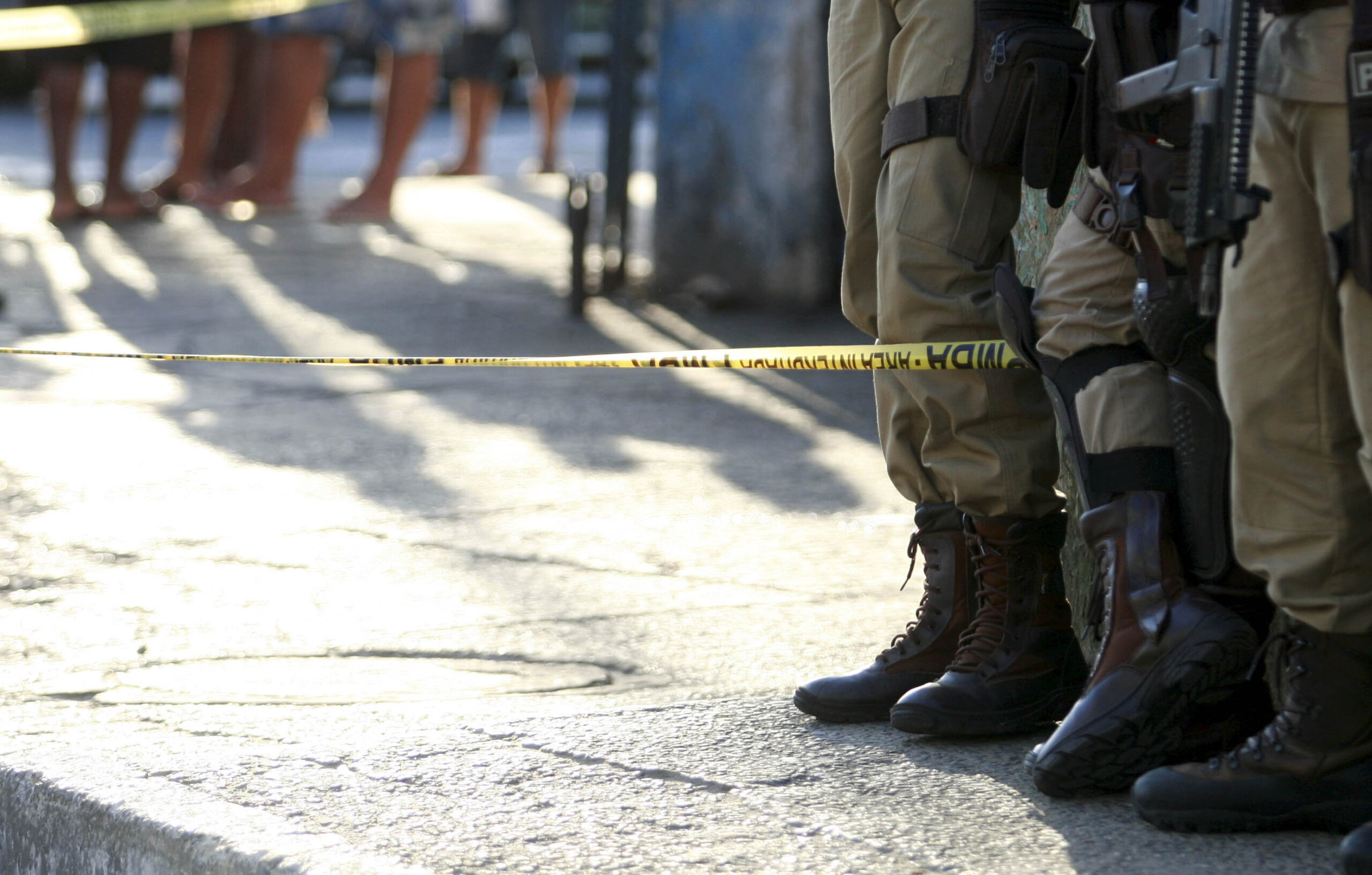 salvador, bahia, brazil - october 4, 2016: military police are seen next to the body of a murdered man in the city of Salvador.
