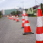 bright orange traffic cones standing in a row